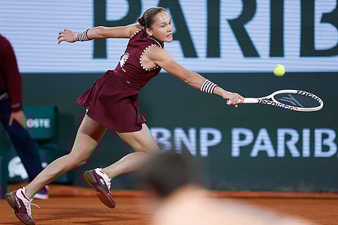 Erika Andreeva plays a shot against Aryna Sabalenka